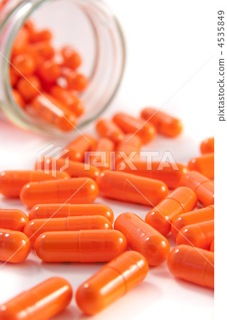 bunch of orange pills bunch of orange pills 4535849