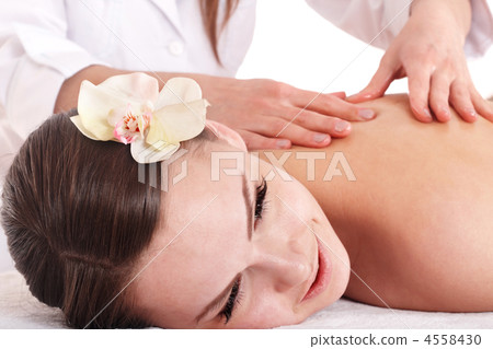 Beautiful white girl having thai massage. Beautiful white girl having thai massage. 4558430