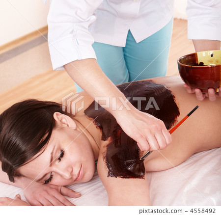 Girl having chocolate body mask . Girl having chocolate body mask . 4558492
