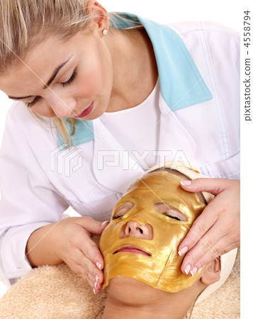 Girl with gold facial mask. 4558794