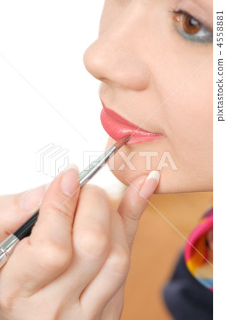 applying liquid glossy lipstick 4558881