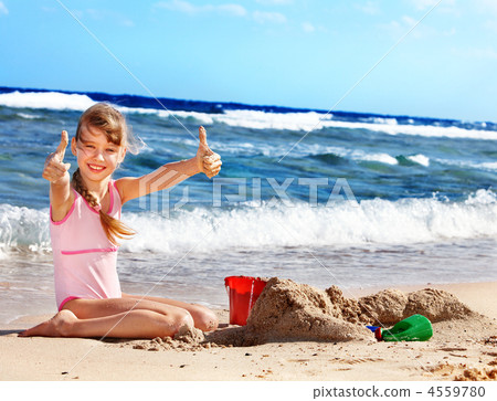 Child playing on  beach. 4559780