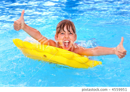 Child sitting on inflatable ring thumb up. Child sitting on inflatable ring thumb up. 4559951