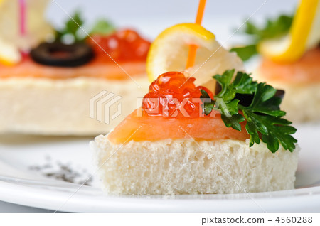 canape with red caviar and smoked salmon canape with red caviar and smoked salmon 4560288