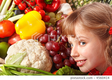 Child girl with group of vegetable and fruit. Child girl with group of vegetable and fruit. 4560414