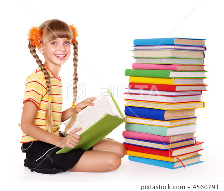 Schoolgirl reading pile of books. Schoolgirl reading pile of books. 4560791