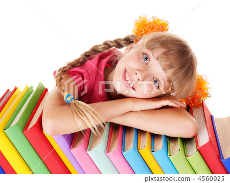 Child reading open  book on table. 4560925