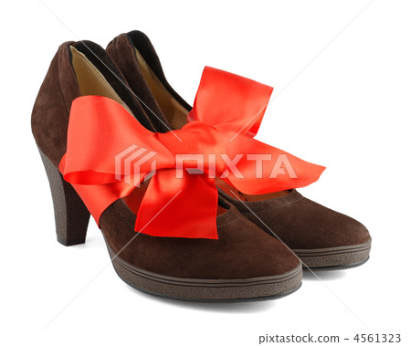 Women's shoes with red gift bow isolated on white background 4561323