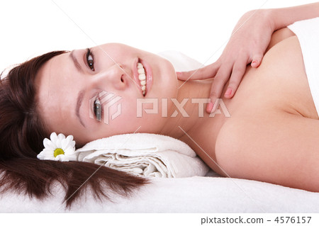 Young woman on massage table in beauty spa. Young woman on massage table in beauty spa. 4576157