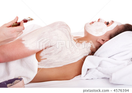 Beautician apply mask to girl. Massage. 4576394