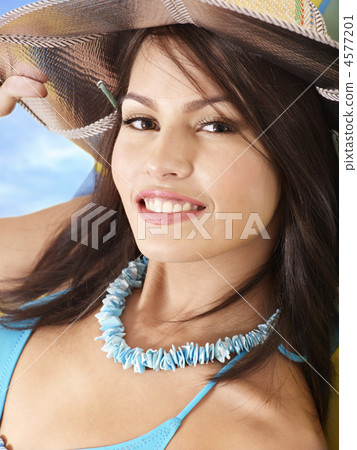 Girl in bikini and hat on beach. Girl in bikini and hat on beach. 4577201