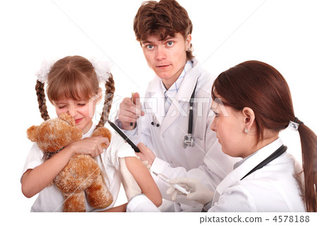 Doctor giving injection to child in arm. 4578188