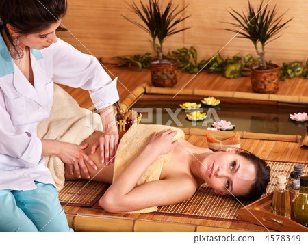 Woman getting massage in bamboo spa. 4578349