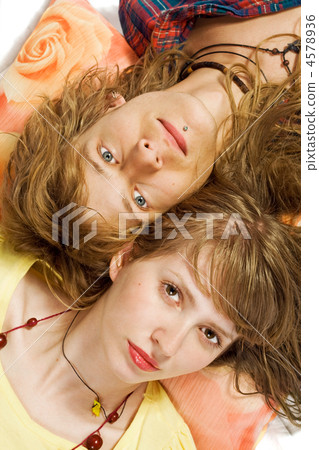 Portrait of the young beautiful couple laying on a pillow Portrait of the young beautiful couple laying on a pillow 4578936
