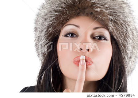 Portrait of the young woman with a finger at lips Portrait of the young woman with a finger at lips 4579994