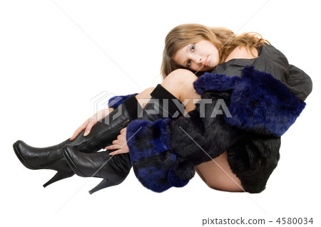 Beautiful girl in a fur coat and boots 4580034