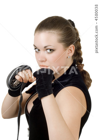 Pretty angry young woman throwing a punch. Isolated Pretty angry young woman throwing a punch. Isolated 4580038