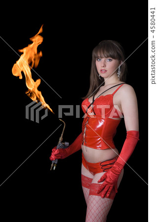 Young woman in red with a gas torch 4580441