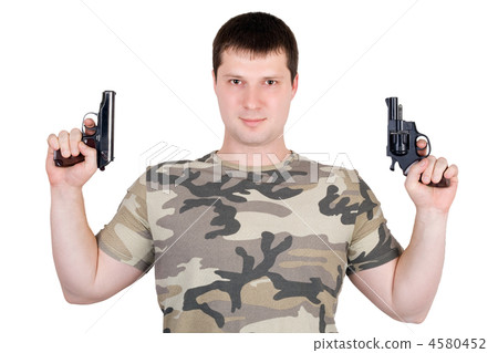 Young man with a two pistol. Isolated Young man with a two pistol. Isolated 4580452