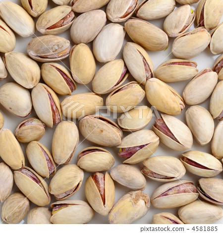 Toasted salted pistachios background Toasted salted pistachios background 4581885