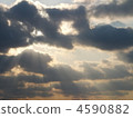 Sunlight shines into the dark clouds 4590882