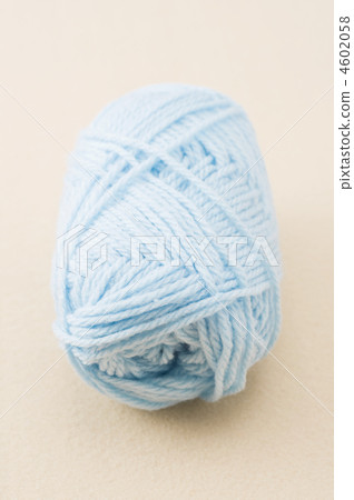 Up of a light blue wool ball Up of a light blue wool ball 4602058