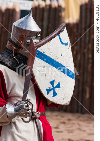 Knight in armour with shield and sword 4619135