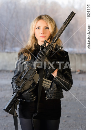 Armed beautiful young woman Armed beautiful young woman 4624595