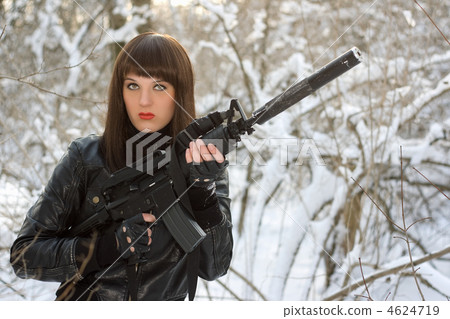 Portrait of young lady with a rifle 4624719