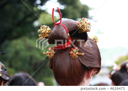 A young woman parading behind the Kochi wig festival 4626471