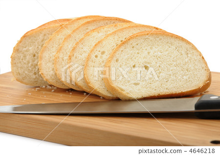 The cut bread on a chopping board with a knife 4646218