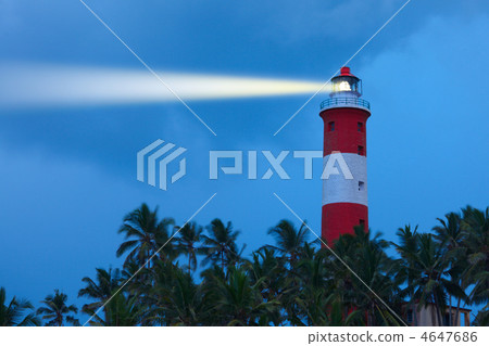 Lighthouse in night with light beam 4647686