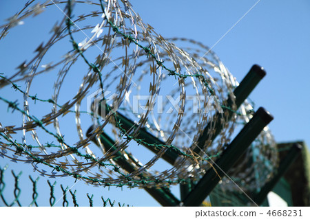 barbed wire against blue sky barbed wire against blue sky 4668231
