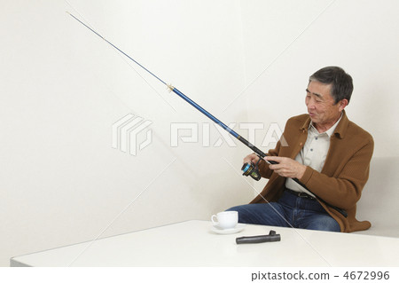 A man who takes care of a fishing rod A man who takes care of a fishing rod 4672996