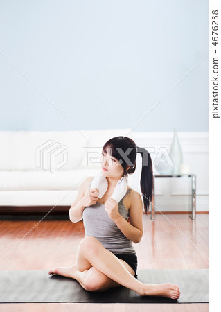Asian woman resting after workout. Asian woman resting after workout. 4676238