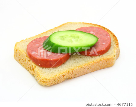 sandwich with sausage and a cucumber sandwich with sausage and a cucumber 4677115