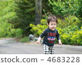 Child walking in fresh green country road 4683228