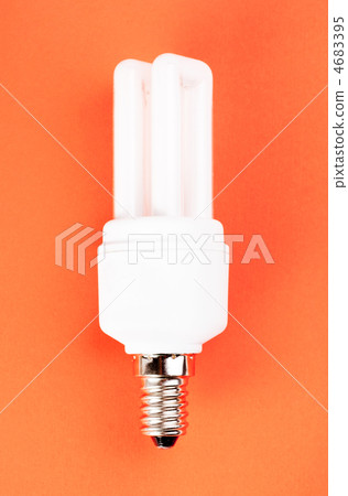 energy saving light bulb on red background 4683395