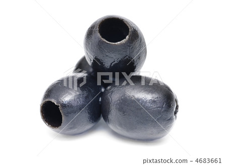Three black pitted olive fruit close up on white background 4683661