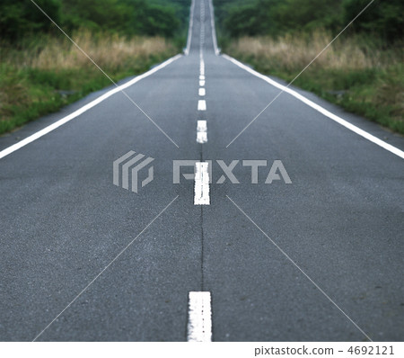 Straight tar road leading into the light Straight tar road leading into the light 4692121