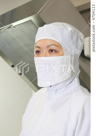 A woman in dust free clothes in front of a clean room facility A woman in dust free clothes in front of a clean room facility 4704113