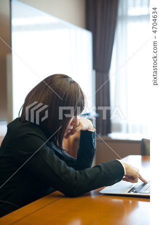 Business woman pushing key of laptop 4704634