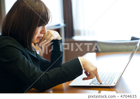 Business woman pushing key of laptop 4704635