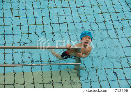 Smiling infant playing in the pool Smiling infant playing in the pool 4712296