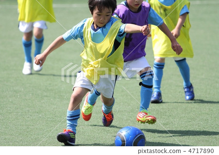 Dribbling scene of a football juven in a uniform 4717890