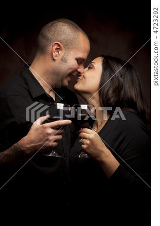 Happy Mixed Race Couple Holding Wine Glasses Happy Mixed Race Couple Holding Wine Glasses 4723292