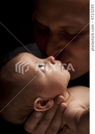 Young Father Holding His Mixed Race Newborn Baby Young Father Holding His Mixed Race Newborn Baby 4723295