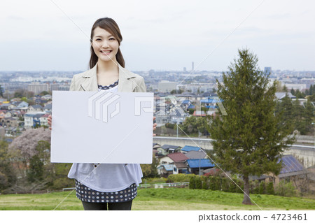 A woman with a message board 4723461