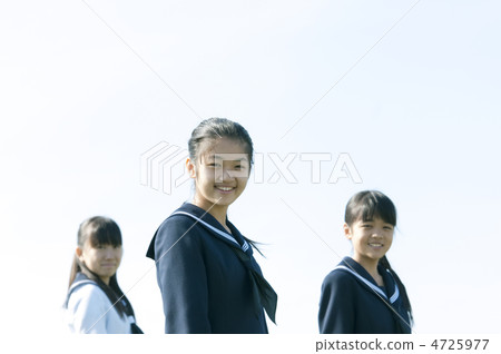 Three junior high school students smiling 4725977