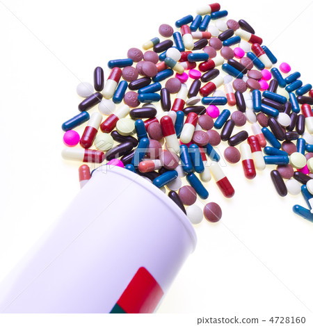 pills spilling out of container pills spilling out of container 4728160